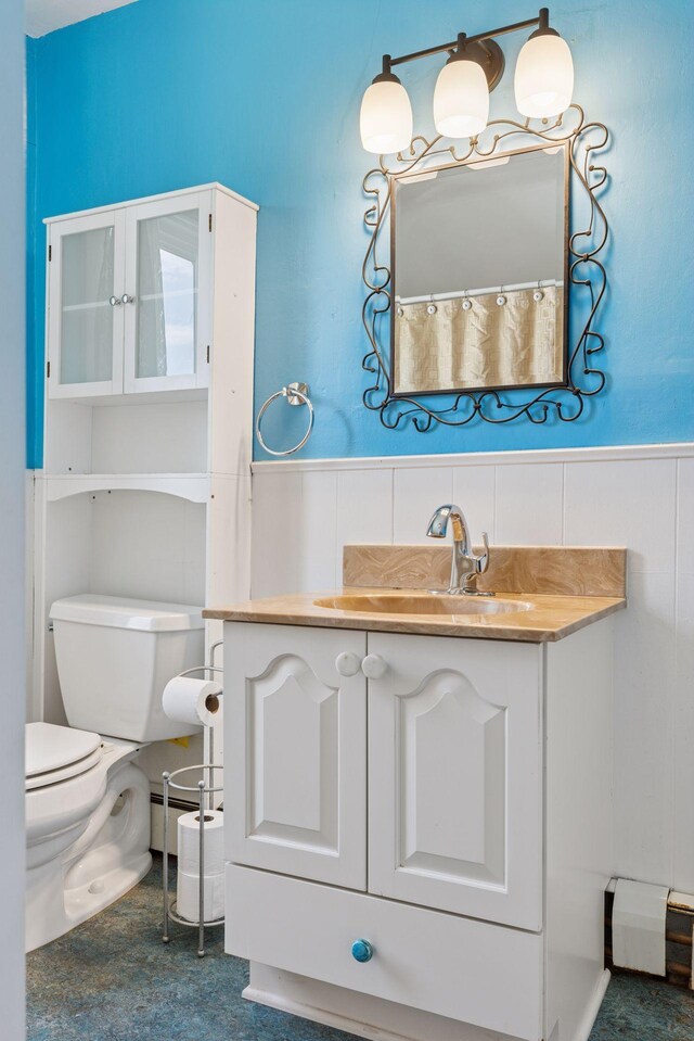 1125 James Ave, Saint Paul, MN 55105 - full bathroom with toilet, a wainscoted wall, and vanity