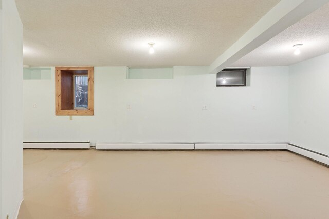 1125 James Ave, Saint Paul, MN 55105 - finished basement featuring a textured ceiling and baseboard heating