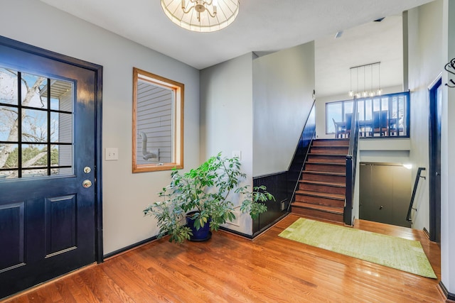 8678 Boiling Springs Ln, Shakopee, MN 55379 - foyer with wood finished floors, stairs, and a chandelier