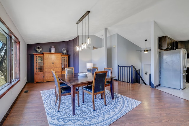 8678 Boiling Springs Ln, Shakopee, MN 55379 - dining space featuring lofted ceiling, plenty of natural light, light wood finished floors, and a ceiling fan
