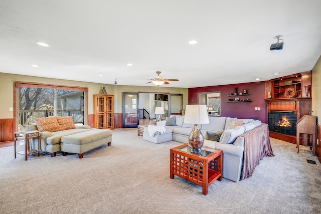 8678 Boiling Springs Ln, Shakopee, MN 55379 - living room featuring carpet floors, recessed lighting, a glass covered fireplace, and a ceiling fan