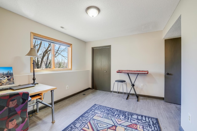 8678 Boiling Springs Ln, Shakopee, MN 55379 - office area featuring wood finished floors and a textured ceiling
