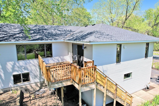 8678 Boiling Springs Ln, Shakopee, MN 55379 - view of front of property with a shingled roof, stairway, and a deck