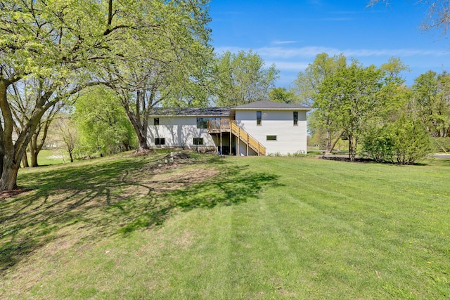 8678 Boiling Springs Ln, Shakopee, MN 55379 - rear view of property featuring a wooden deck, a lawn, and stairs