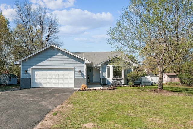 1905 125th Ave NE, Blaine, MN 55449 - view of front facade with driveway, an attached garage, a front lawn, and brick siding