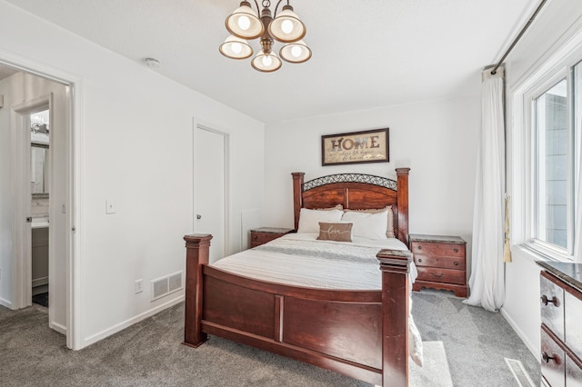 1905 125th Ave NE, Blaine, MN 55449 - carpeted bedroom with a chandelier and baseboards