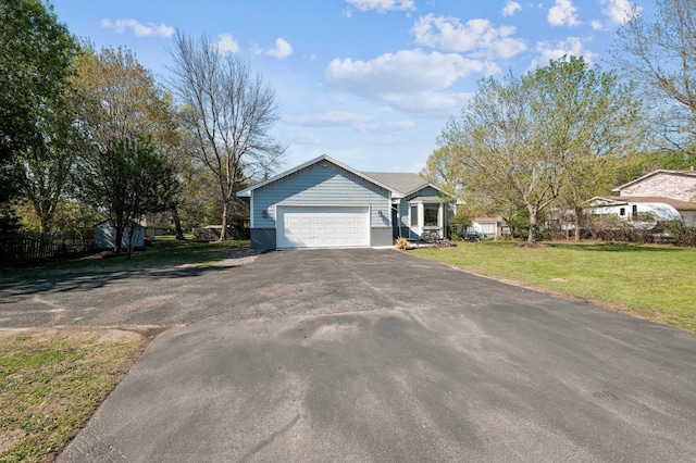 1905 125th Ave NE, Blaine, MN 55449 - ranch-style home featuring asphalt driveway, a garage, and a front yard