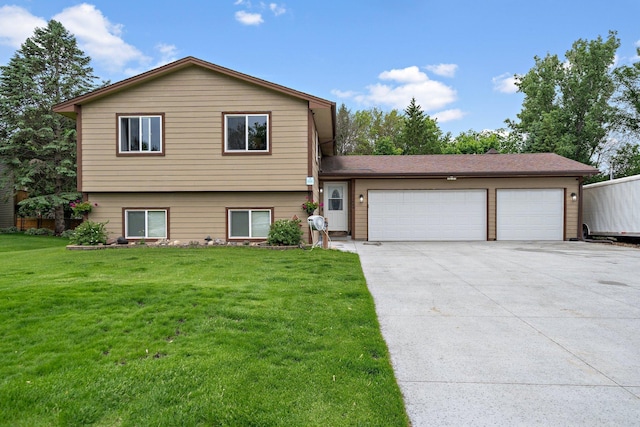 11469 Sumter Ave N, Champlin, MN 55316 - split level home featuring concrete driveway, a garage, and a front lawn