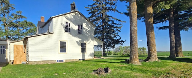 38901 134th St, Canton Twp, MN 55922 - view of side of property featuring a lawn and a chimney