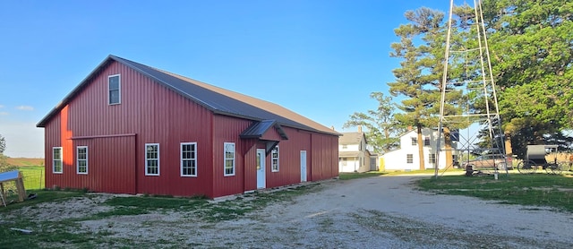 38901 134th St, Canton Twp, MN 55922 - view of side of property with an outdoor structure, driveway, and an outbuilding