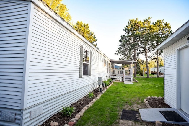 view of green lawn with a porch