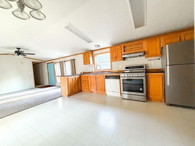 kitchen with stainless steel appliances, under cabinet range hood, open floor plan, ceiling fan, and brown cabinets