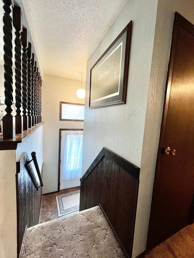 1416 13th Ave, Clarkfield, MN 56223 - staircase featuring a textured ceiling and a textured wall