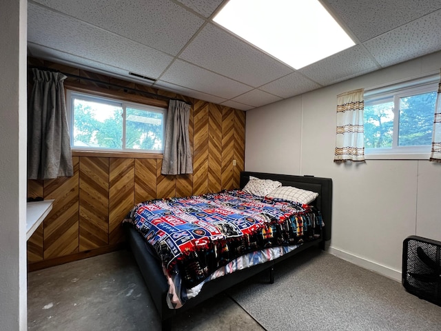 1416 13th Ave, Clarkfield, MN 56223 - bedroom featuring a drop ceiling, wood walls, and baseboards