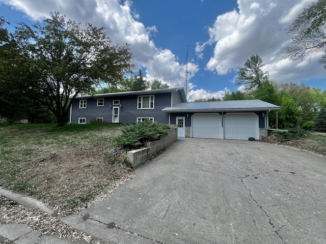 1416 13th Ave, Clarkfield, MN 56223 - view of front facade with an attached garage and asphalt driveway