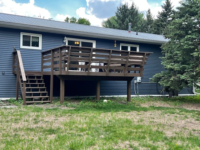 1416 13th Ave, Clarkfield, MN 56223 - back of property featuring a wooden deck, metal roof, and stairway
