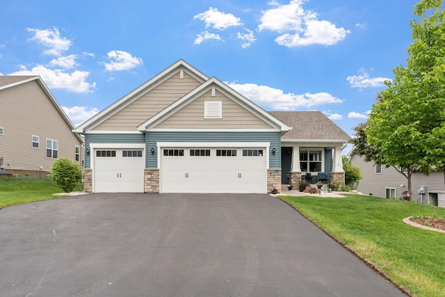 20938 Grommet Ave, Lakeville, MN 55044 - craftsman inspired home with stone siding, driveway, a front yard, and a garage