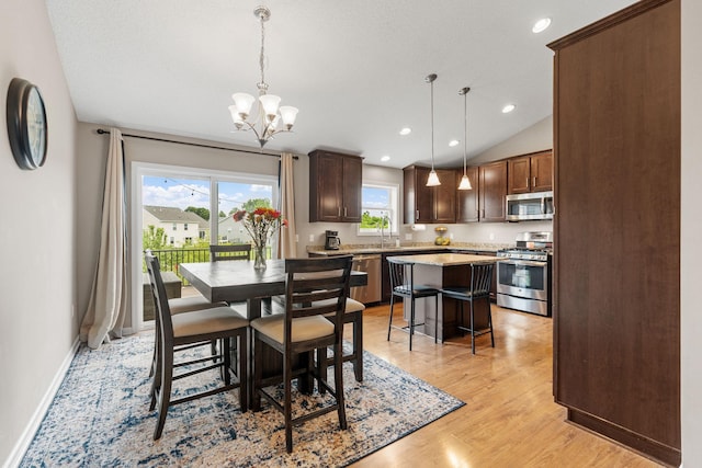20938 Grommet Ave, Lakeville, MN 55044 - dining area featuring a chandelier, light wood-style flooring, recessed lighting, baseboards, and lofted ceiling