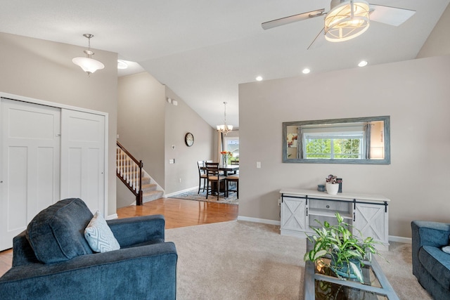 20938 Grommet Ave, Lakeville, MN 55044 - living room featuring vaulted ceiling, light colored carpet, stairway, a ceiling fan, and baseboards
