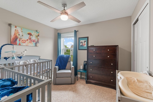 20938 Grommet Ave, Lakeville, MN 55044 - carpeted bedroom with ceiling fan, a nursery area, and a textured ceiling