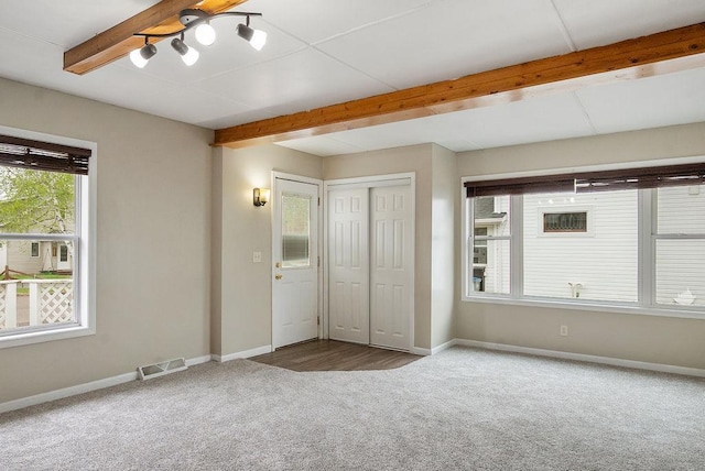 435 6th St, Cloquet, MN 55720 - unfurnished bedroom featuring carpet floors, beamed ceiling, baseboards, and a closet