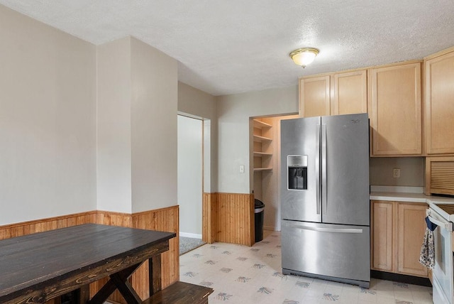 435 6th St, Cloquet, MN 55720 - kitchen featuring stainless steel refrigerator with ice dispenser, light brown cabinetry, white electric range oven, a textured ceiling, and light countertops