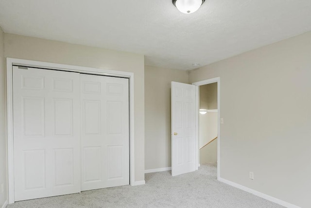435 6th St, Cloquet, MN 55720 - unfurnished bedroom featuring carpet floors, baseboards, and a closet