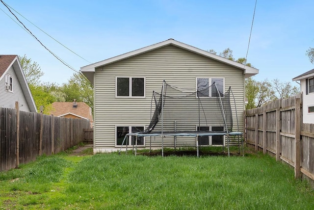 435 6th St, Cloquet, MN 55720 - back of property featuring a trampoline