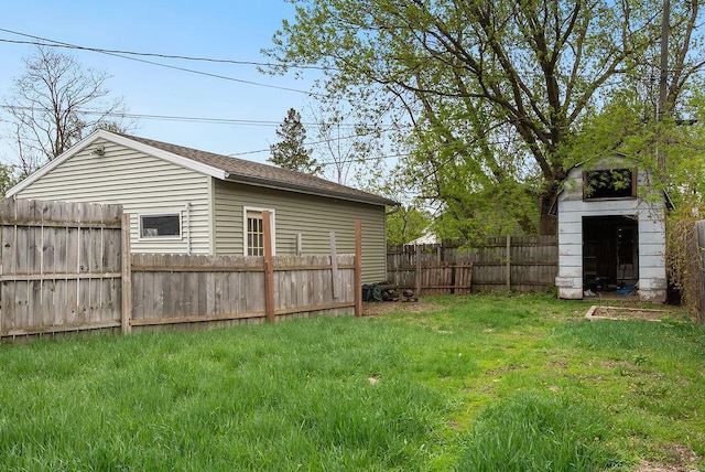 435 6th St, Cloquet, MN 55720 - view of yard with a storage unit and an outbuilding