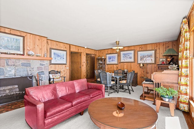 21895 County Road 8, Bovey, MN 55709 - living area featuring wooden walls and a stone fireplace