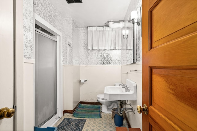 21895 County Road 8, Bovey, MN 55709 - bathroom featuring a shower stall, toilet, and a sink