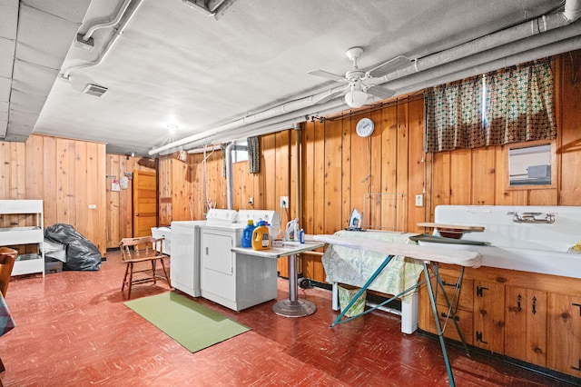 21895 County Road 8, Bovey, MN 55709 - finished below grade area featuring wooden walls, tile patterned floors, separate washer and dryer, and ceiling fan