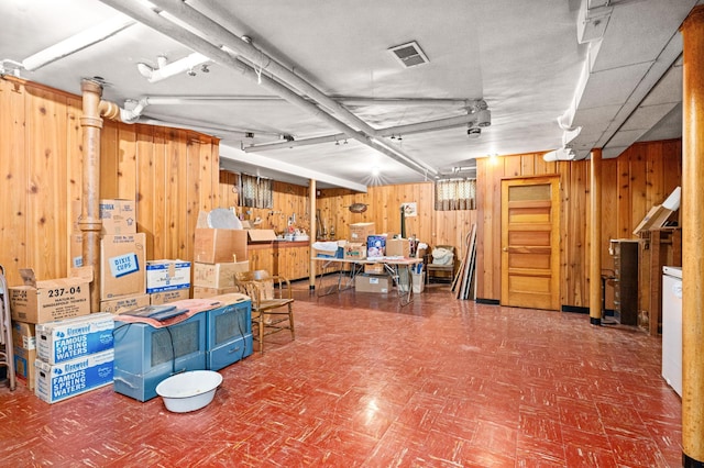 21895 County Road 8, Bovey, MN 55709 - finished below grade area featuring wood walls and tile patterned floors