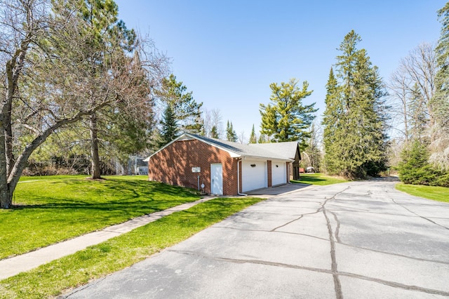21895 County Road 8, Bovey, MN 55709 - garage with asphalt driveway