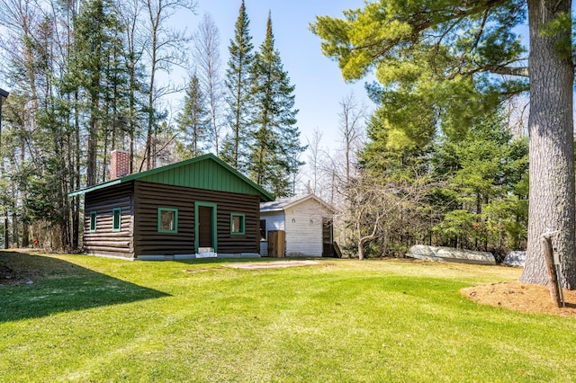 21895 County Road 8, Bovey, MN 55709 - view of front of home featuring a chimney and a front lawn