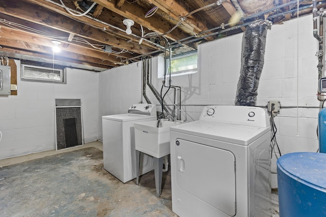 washroom with independent washer and dryer and electric panel