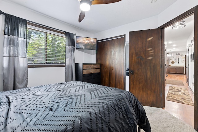 6242 Pecan St, North Branch, MN 55056 - carpeted bedroom featuring ceiling fan, a closet, and ensuite bathroom