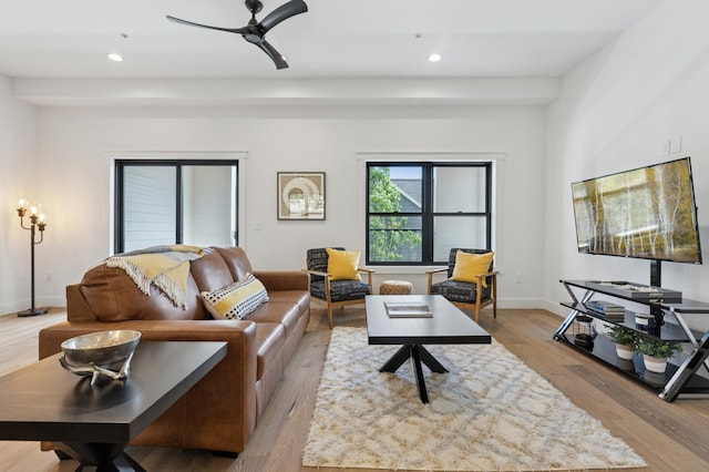 living room featuring recessed lighting, ceiling fan, light wood-style flooring, and baseboards