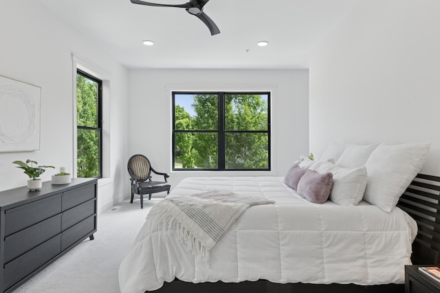 bedroom featuring light colored carpet, ceiling fan, and recessed lighting