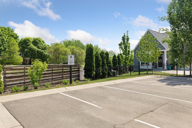 uncovered parking lot with fence