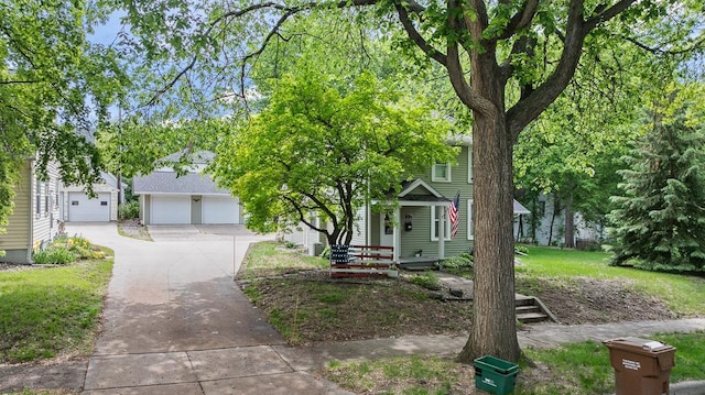 212 4, Montevideo, MN 56265 - view of property hidden behind natural elements featuring a garage and driveway