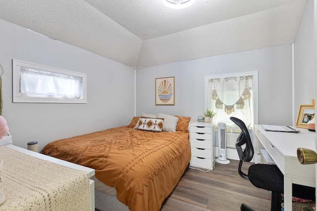 212 4, Montevideo, MN 56265 - bedroom with wood finished floors, lofted ceiling, and an office area