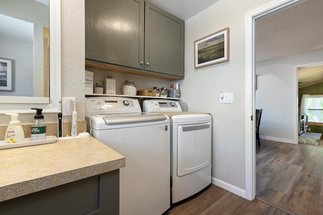 212 4, Montevideo, MN 56265 - laundry room featuring cabinet space, dark wood-style floors, separate washer and dryer, and baseboards