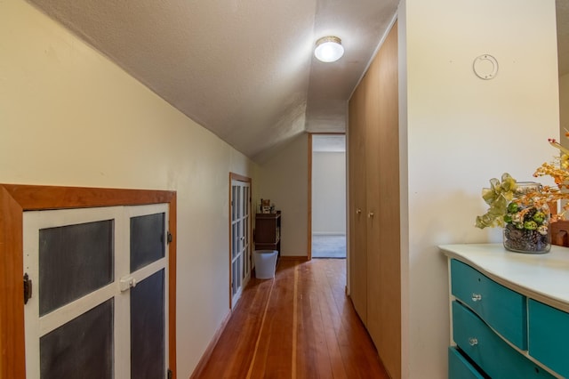 207 2nd Ave W, Balsam Lake, WI 54810 - hallway with dark wood finished floors, lofted ceiling, and a textured ceiling