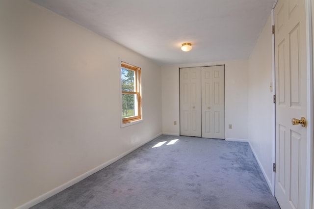 207 2nd Ave W, Balsam Lake, WI 54810 - unfurnished bedroom with carpet flooring, baseboards, and a closet