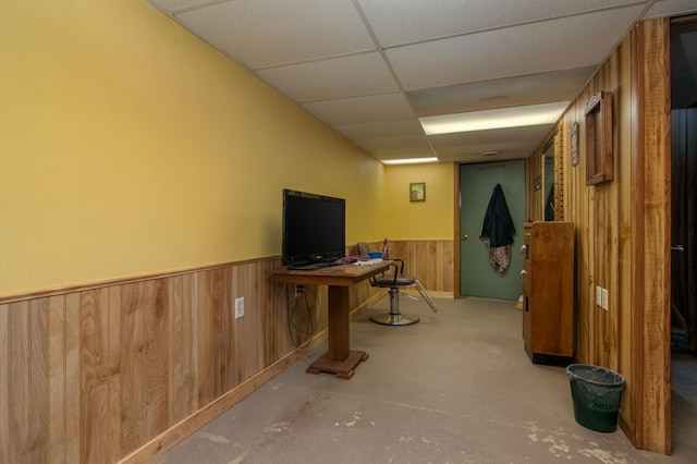 207 2nd Ave W, Balsam Lake, WI 54810 - finished basement featuring a paneled ceiling, wooden walls, and a wainscoted wall