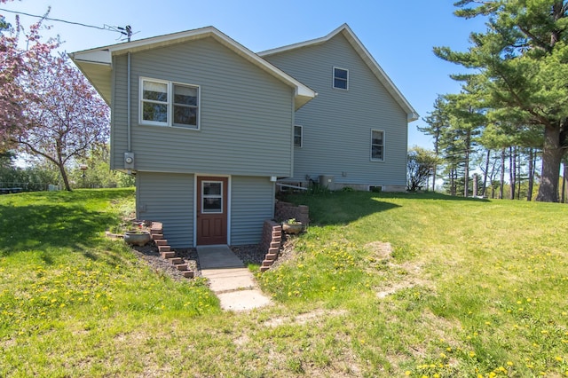 207 2nd Ave W, Balsam Lake, WI 54810 - rear view of house featuring a lawn