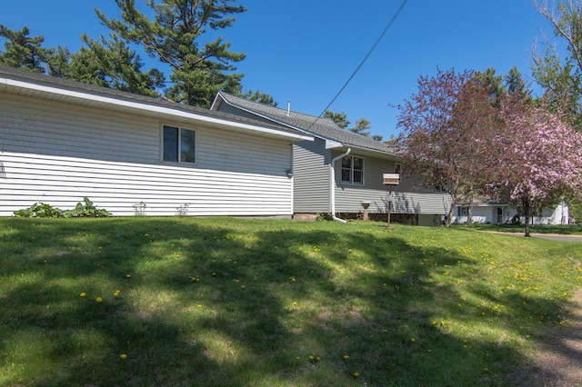 207 2nd Ave W, Balsam Lake, WI 54810 - view of property exterior with a lawn