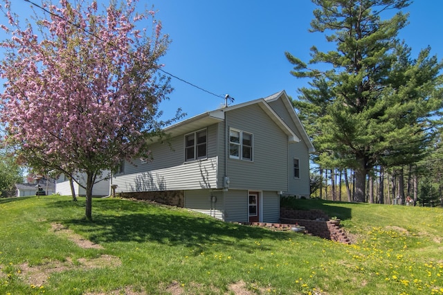 207 2nd Ave W, Balsam Lake, WI 54810 - view of home's exterior featuring a yard
