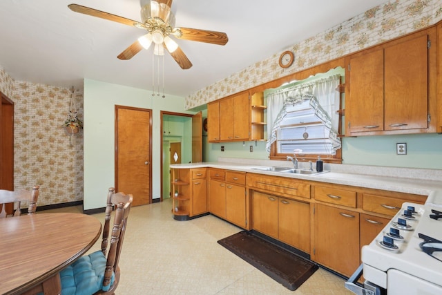 4518 Colfax Ave N, Minneapolis, MN 55412 - kitchen with a sink, open shelves, wallpapered walls, light countertops, and brown cabinets